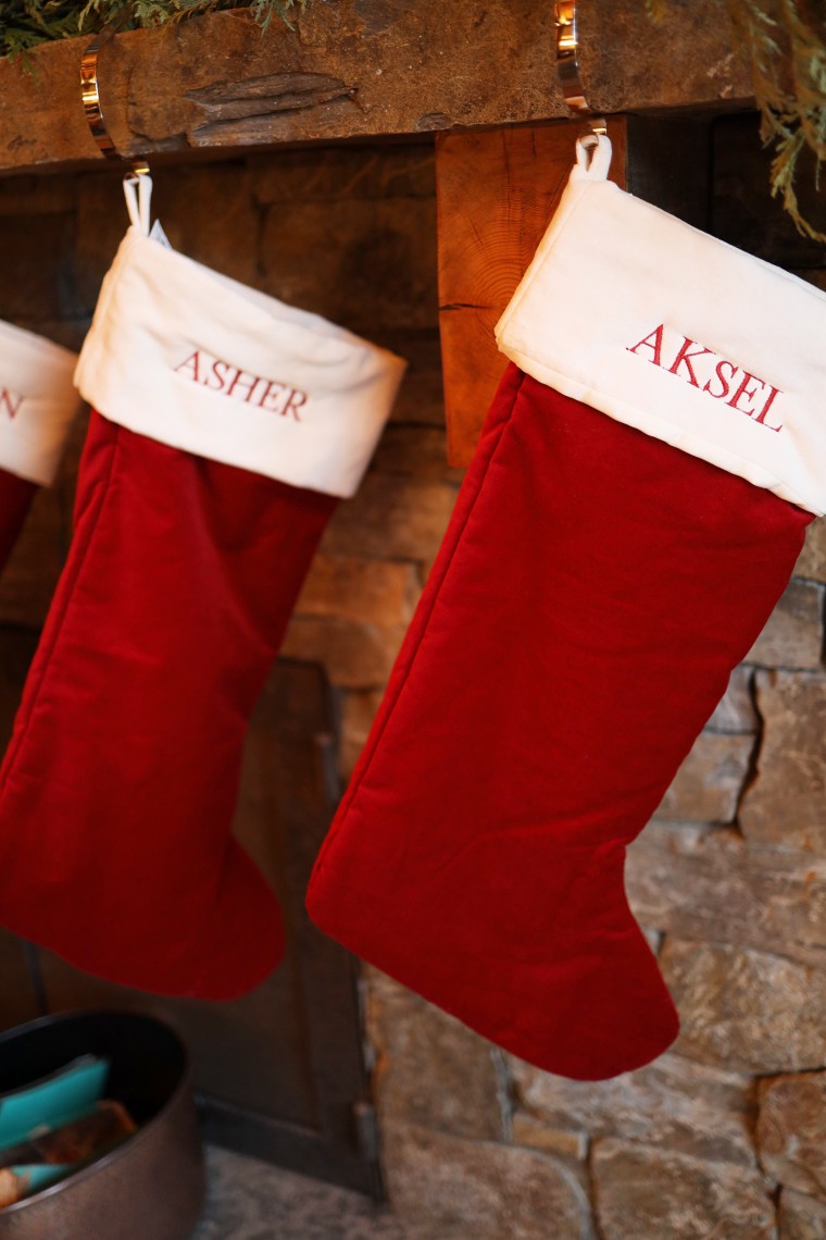 Christmas stockings with the names of the newborn twins.