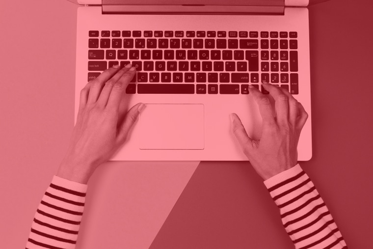 Cropped Hands Of Woman Using Laptop Over Colored Background
