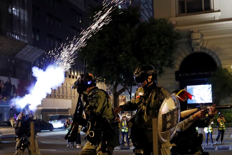 Image: Riot police fire tear gas to disperse anti-government demonstrators.