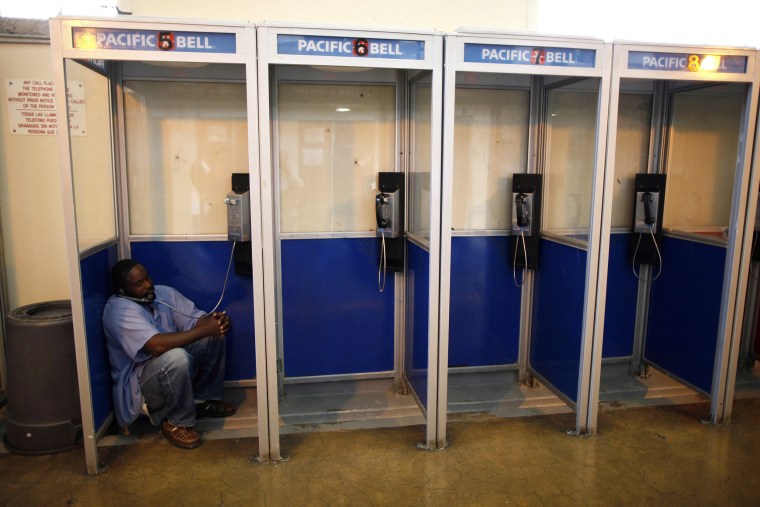 Image: An inmate talks on the phone at San Quentin state prison in San Quentin, California.