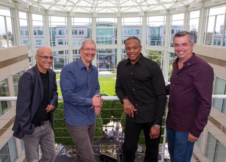 Image: Music entrepreneur and Beats co-founder Jimmy Iovine, Apple CEO Tim Cook, Beats co-founder Dr. Dre, and Apple senior vice president Eddy Cue pose together at Apple headquarters in Cupertino