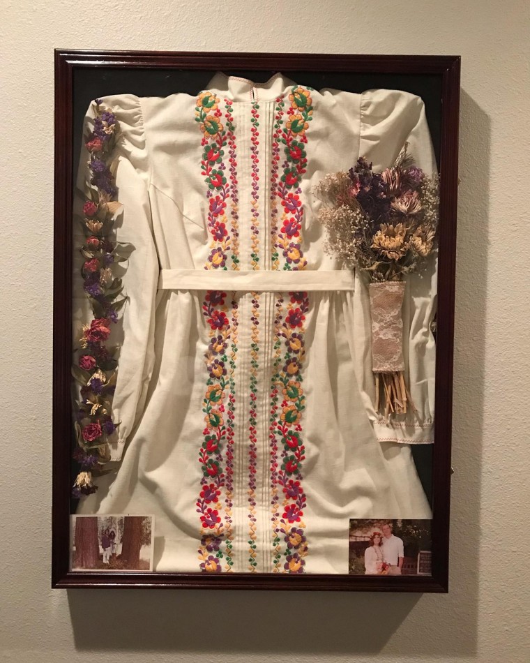 Anderson keeps her mother's dress safe in a shadow box with photos of both happy couples on their respective wedding days.