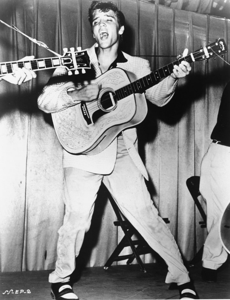 Elvis Presley performs in 1956 in a photo that was used for his first RCA Victor album cover.