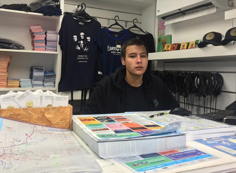 Image: Ibrahim Srur, 22, who works at a tourist information desk on  Rothschild Boulevard, Tel Aviv.