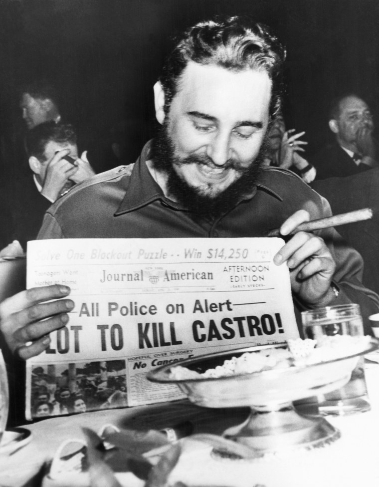 Fidel Castro Displaying Murder Plot Headline