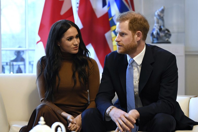 Image: Britain's Prince Harry and Meghan, Duchess of Sussex gesture during their visit to Canada House in thanks for the warm Canadian hospitality and support they received during their recent stay in Canada, in London