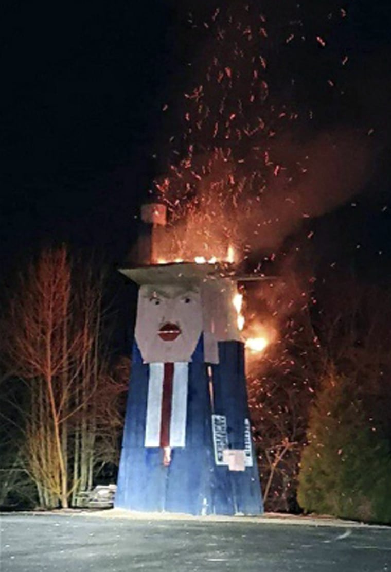 Image: Donald Trump wooden sculpture burned