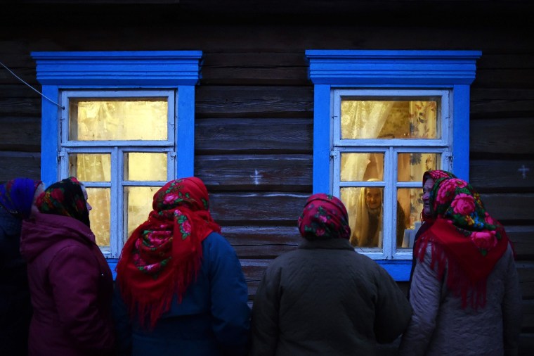 Villagers celebrate Kalyady, is an ancient pagan holiday originally celebrated on winter solstice, in the village of Danilevichy, Belarus on Jan. 7, 2020. Kalyady. Dressed-up people walk from house to house singing, dancing, eating and drinking with their neighbors.