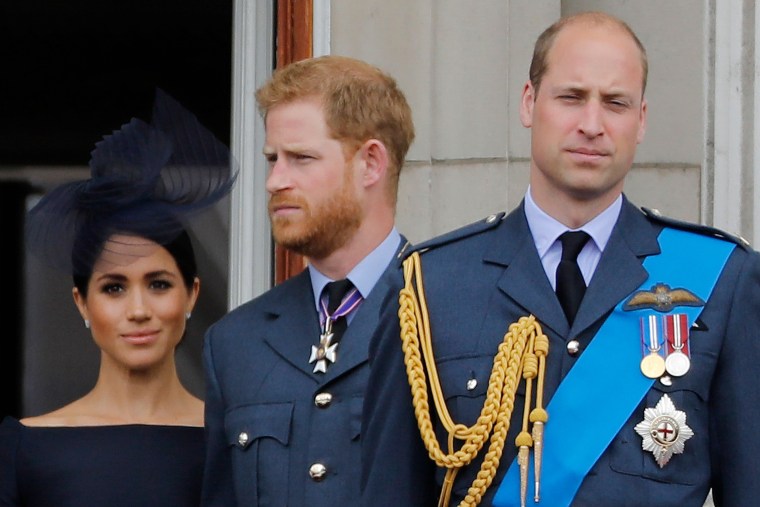 Image: Prince Harry, his wife Meghan and Prince William on the balcony of Buckingham Palace in July 2018.