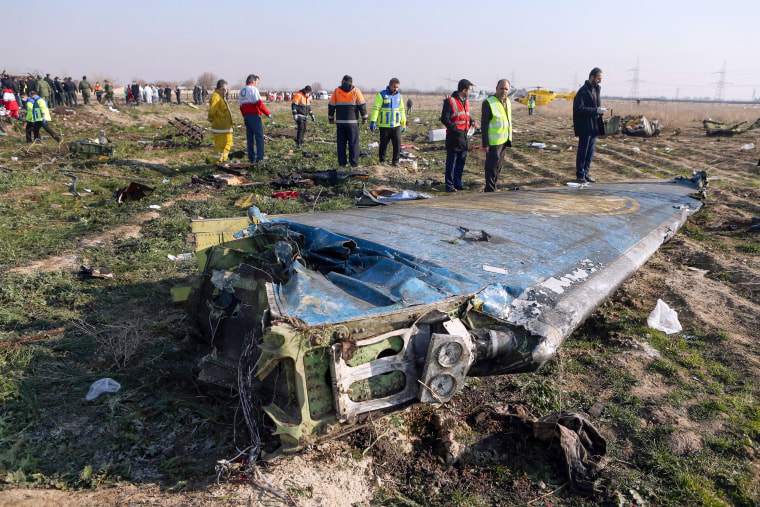 Image: Rescue teams are seen at the scene of a Ukrainian airliner that crashed shortly after take-off near Imam Khomeini airport in the Iranian capital Tehran