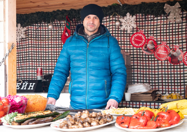 Image: Oleksandr Potapenk, 44, a Christmas market vendor in Kyiv.