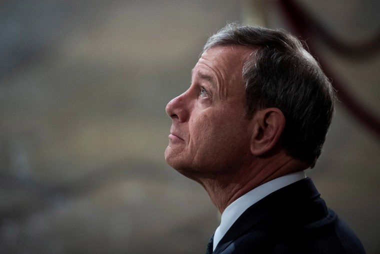 Image: Supreme Court Chief Justice of the United States John G. Roberts, Jr. waits for the arrival of Former president George H.W. Bush to lie in State at the U.S. Capitol Rotunda