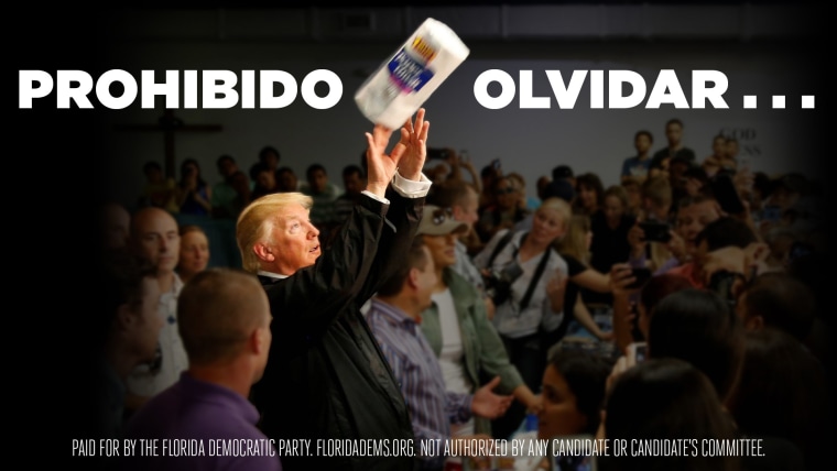 Image: A billboard installed by Democrats in Kissimmee, Florida shows President Donald Trump throwing paper towels to residents of Puerto Rico following Hurricane Maria.