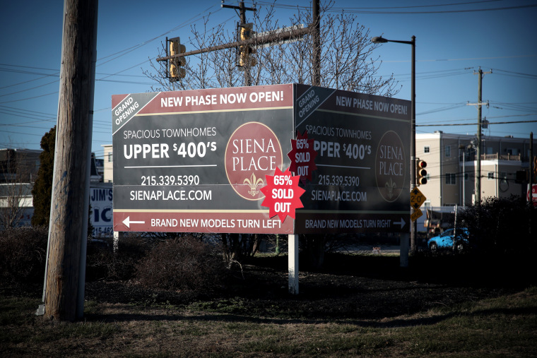 Image: A sign advertising new townhouses built less than 1,000 feet from the Philadelphia Energy Solutions refinery site.