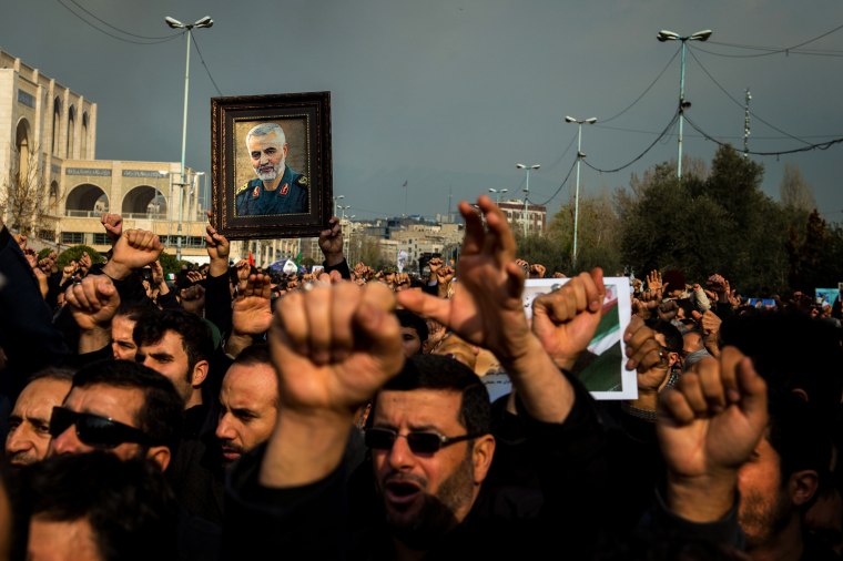 Image: Protesters hold a photo of Iranian General Qassem Soleimani during a demonstration in Tehran on Jan. 3, 2020.