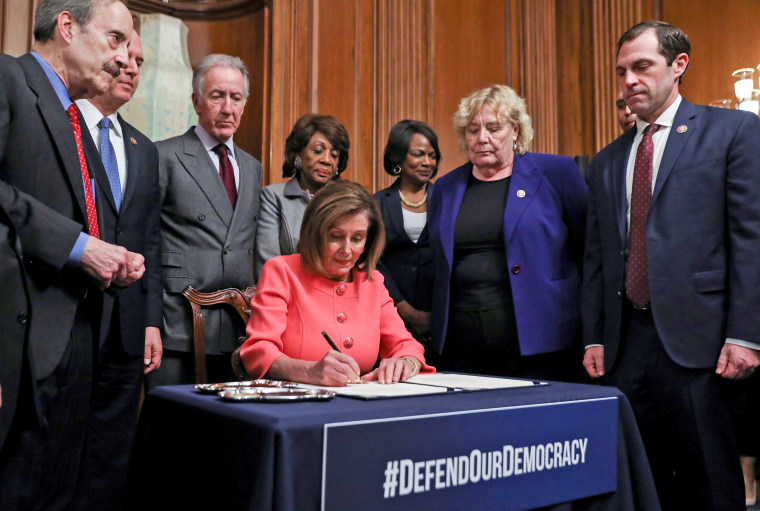 Image: U.S. House Speaker Pelosi holds engrossment ceremony to sign Trump impeachment articles at the U.S. Capitol in Washington
