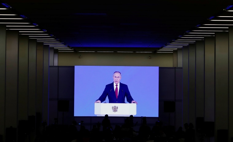 Image: Russian President Vladimir Putin delivers his annual state of the nation address to the Federal Assembly in Moscow