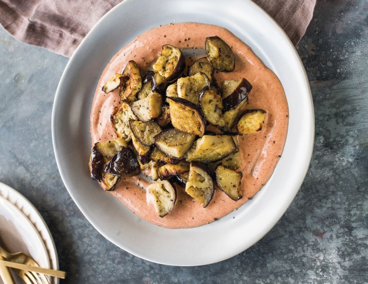 Image; Switch up your side dish routine with this carmelized eggplant with harissa yogurt recipe