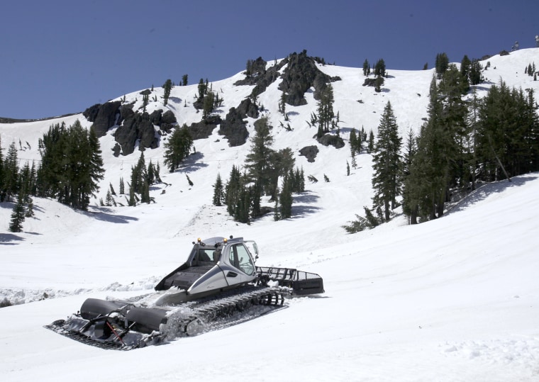 A snow cat grooms one of the slopes at Alpine Meadows Ski Resort near Tahoe City, Calif., on June 30, 2011.