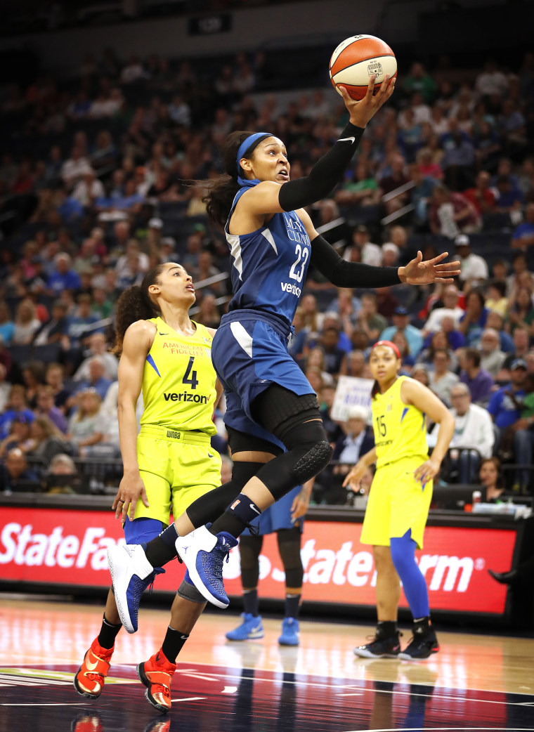 Minnesota Lynx forward Maya Moore shoots over Dallas Wings guard Skylar Diggins-Smith a game on May 23, 2018 in Minneapolis.