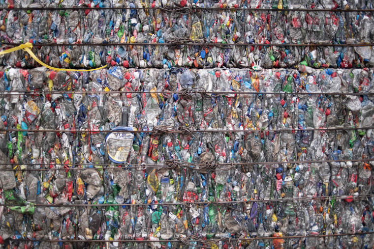 Image: A block of compressed plastic at a plastic waste center on the outskirts of Beijing.