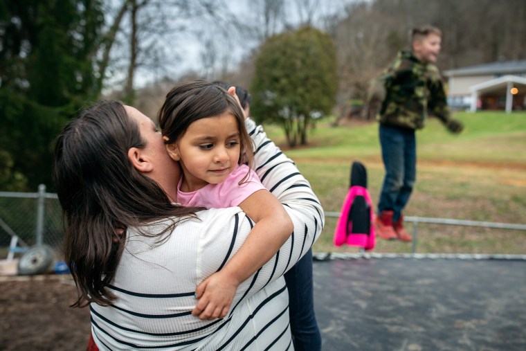 Louisa Snuffer, 42, holds her four-year-old daughter Brynn. As the state grapples with a growing child welfare crisis, the Snuffers are among the many families who have stepped in to help.