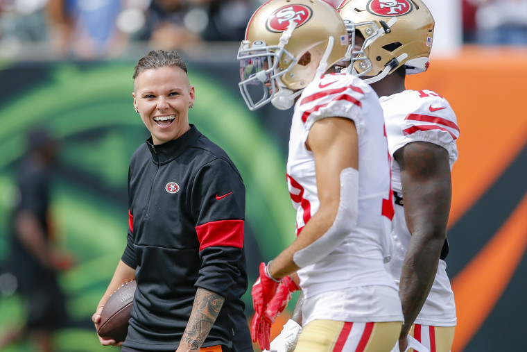 San Francisco 49ers offensive assistant coach Katie Sowers stands on the field before an NFL football game against the Cincinnati Bengals in Cincinnati on Sept. 15, 2019.