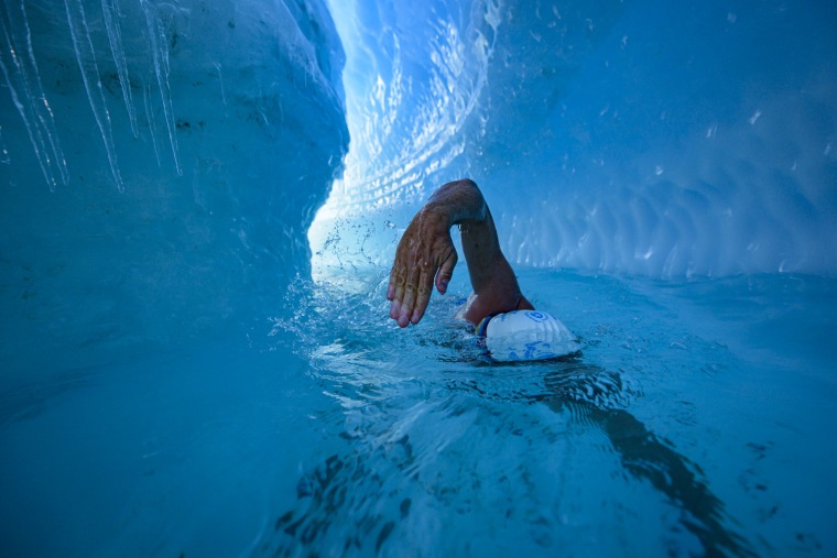 Lewis Pugh trains in a river under the Antarctic ice sheet, as he prepares for "toughest" swim of his life