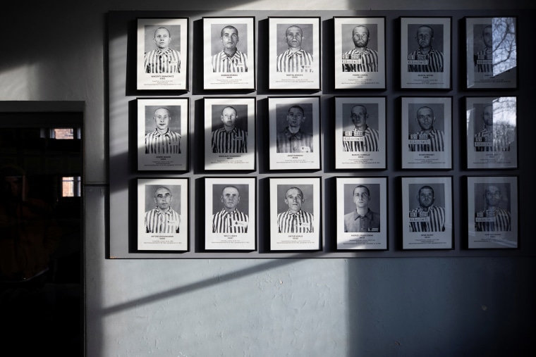 Image: Pictures of prisoners are displayed in the former Nazi German Auschwitz concentration camp complex in Oswiecim, Poland
