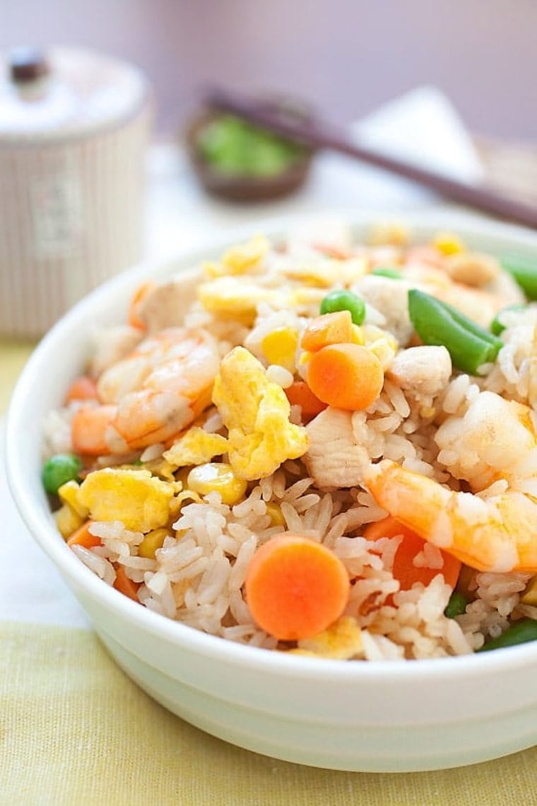 Fried rice is made from leftover rice, and having food left over signifies abundance.