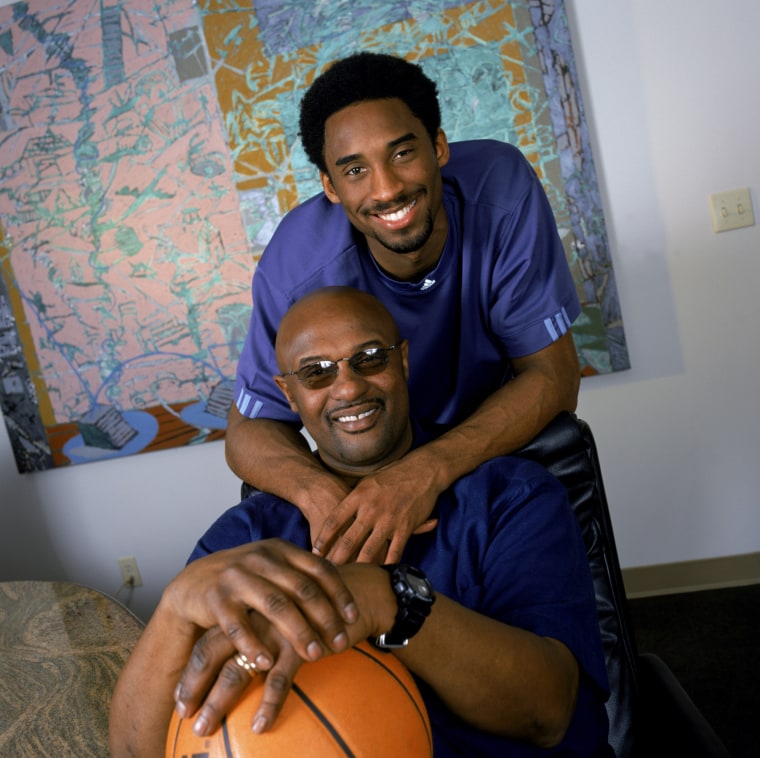 Image: Kobe Bryant poses for a photo with his father, former NBA player Joe Bryant, in Los Angeles in November 2000.
