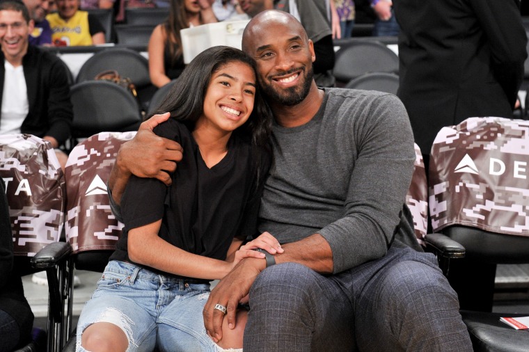 Image: Kobe Bryant hugs his daughter, Gianna, during a Los Angeles Lakers game on Nov. 17, 2019.