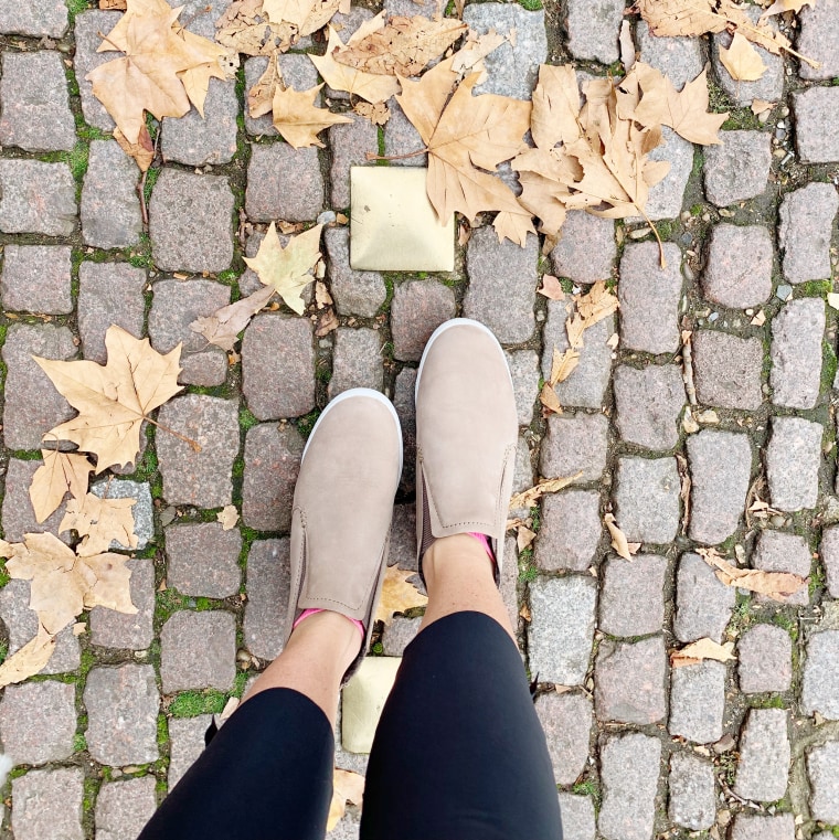 Wearing the waterproof sneaker booties on a fall day in London.