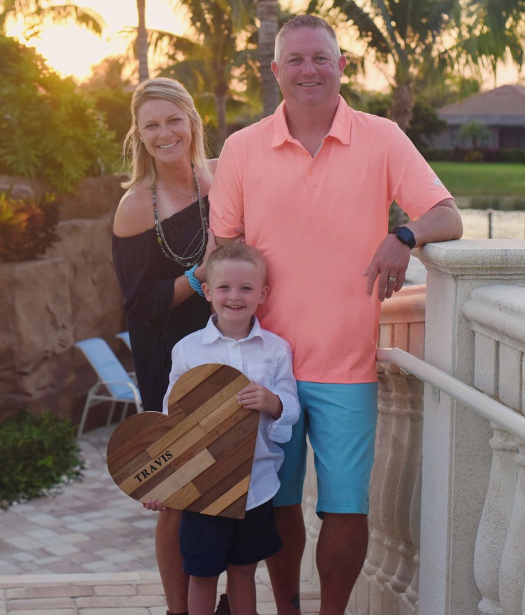 On a recent family vacation to Florida, the Glennons carried Travis's wooden heart so he could be in their pictures.