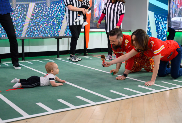 Baby Leo tries to get to his parents in the end zone.