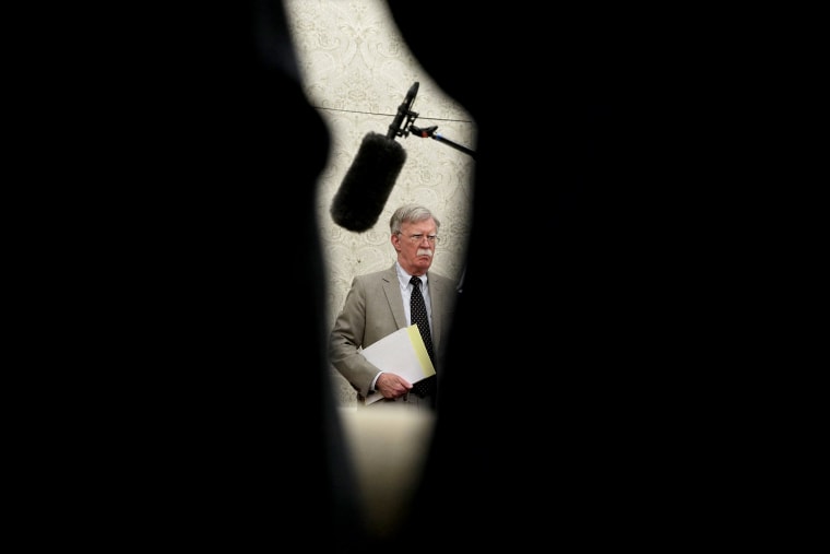 Image: National Security Adviser John Bolton listens in the Oval Office on Aug. 20, 2019.