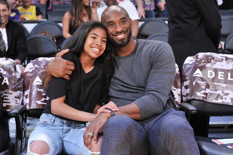 Image: Kobe Bryant and his daughter Gianna Bryant attend a basketball game between the Los Angeles Lakers and the Atlanta Hawks at Staples Center