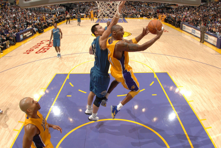 Image: Kobe Bryant of the Los Angeles Lakers attempts a shot against Yi Jianlian of the Washington Wizards at Staples Center on Dec. 7, 2010 in Los Angeles.