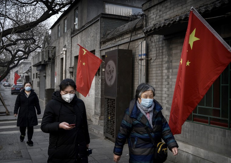 Image: Women wear protective masks in the midst of a coronavirus outbreak in Beijing on Jan. 28, 2020.