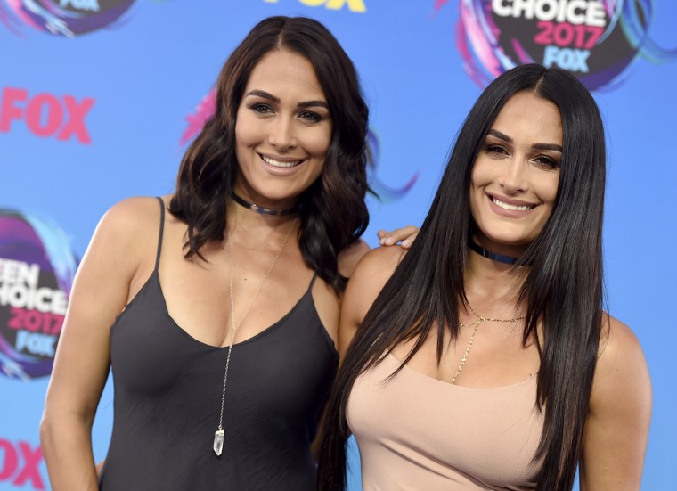 Image: Brie Bella and Nikki Bella arrive at the Teen Choice Awards in Los Angeles in 2017.