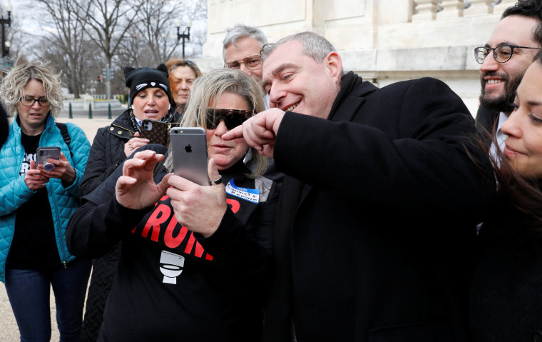 Image: Lev Parnas, an indicted associate of Rudy Giuliani, poses for a selfie with protester outside of the Capitol on Jan. 29, 2020.