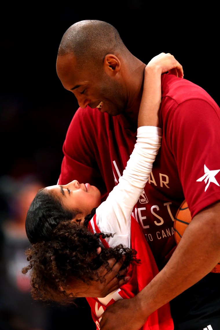 Image: Kobe Bryant hugs his daughter, Gianna, at a game in Toronto in 2016.