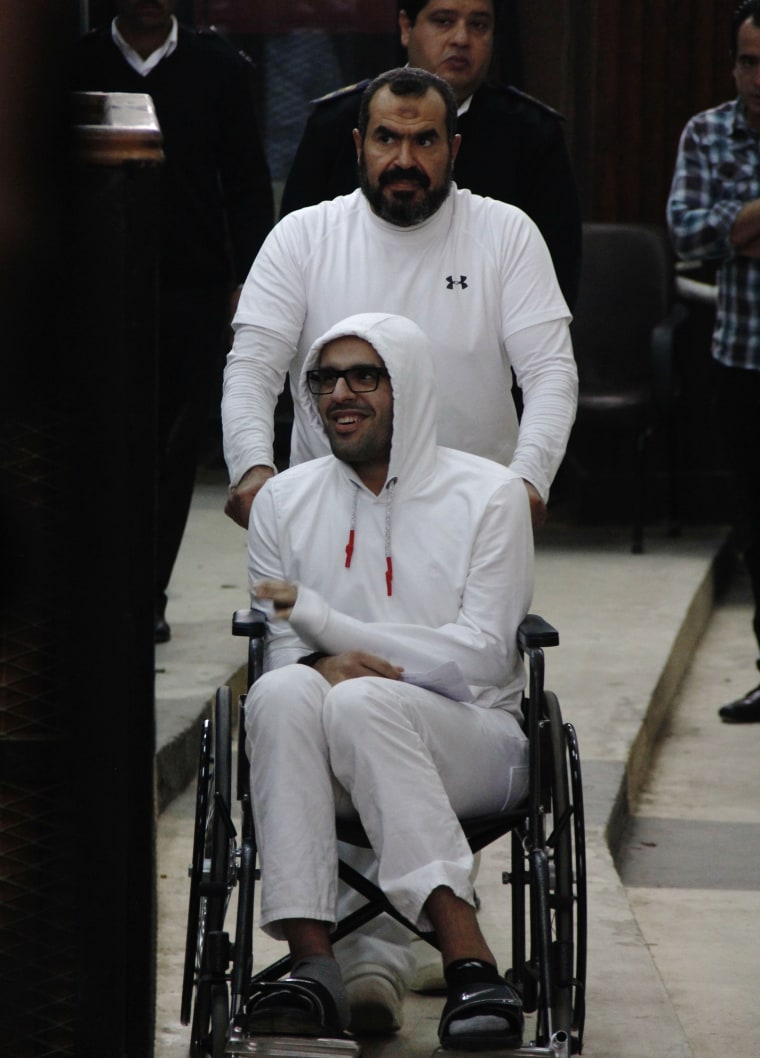 In this March 9, 2015 photo, Mohammed Soltan is pushed by his father Salah during a court appearance in Cairo, Egypt.