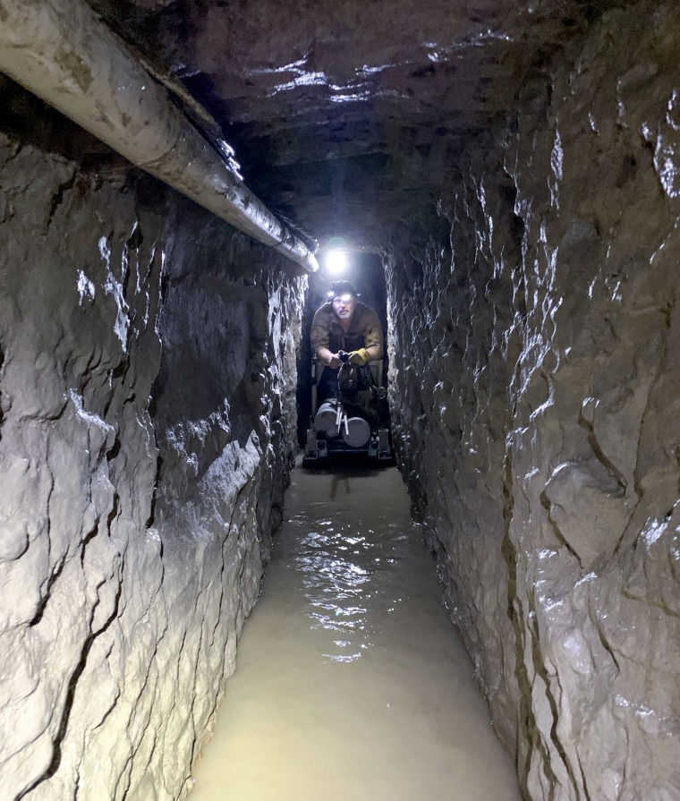 Image: U.S. Customs and Border Protection agents required oxygen canisters while mapping out the drug smuggling tunnel.