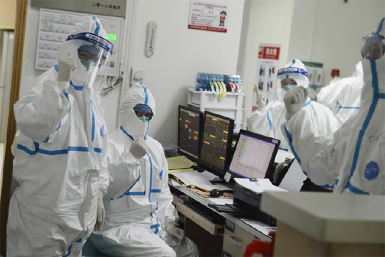 Image: The official Weibo page for Wuhan Central Hospital posted a photo on January 22 appearing to show medical staff in hazmat suits making a sign of resolve.