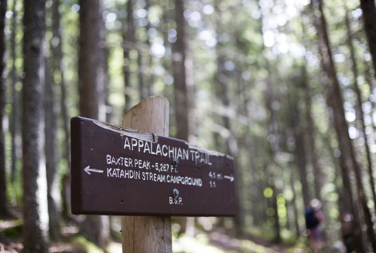 Image: A sign post directs hikers on the Hunt Trail, a section of the Appalachian Trail and popular route to Baxter Peak on Mt. Katahdin.