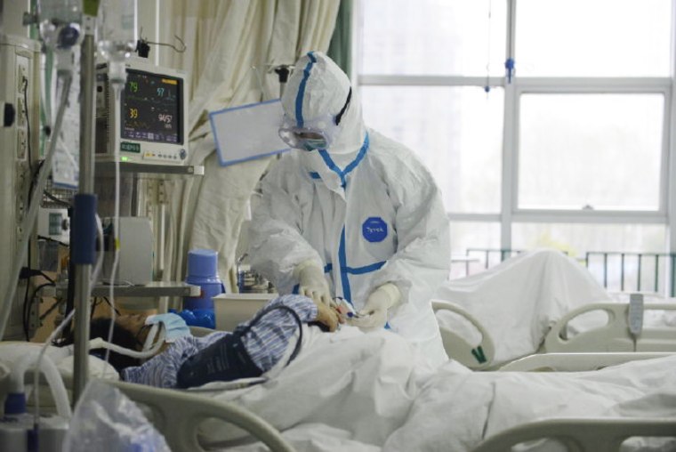 Medical staff of Wuhan Central Hospital in China tend to patients in the respiratory and critical care ward.