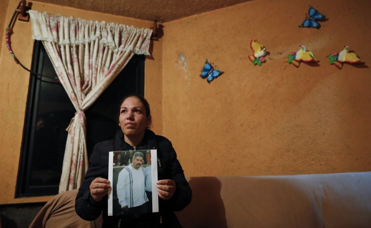Rebeca Valencia Gonzalez, 39, holds a picture of her late husband, environmental activist Homero Gomez Gonzalez, in their home in Ocampo, Mexico, on Jan. 30, 2020.