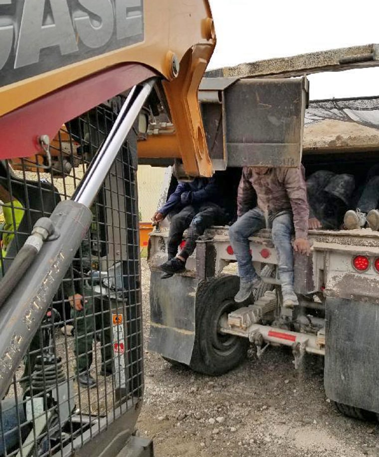 The Heavy duty vehicle is a dump truck that possessed plywood sheets affixed to the center of the container. This modification created two separate containers. The bottom container concealed the 36 undocumented immigrants.