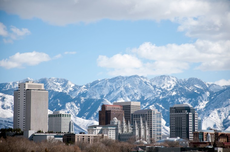 Salt Lake City Utah Winter Skyline With Snow Covered Mountains